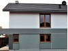 Небольшой двухэтажный дом с современными архитектурными элементами, подходящий для узкого участка - Z297